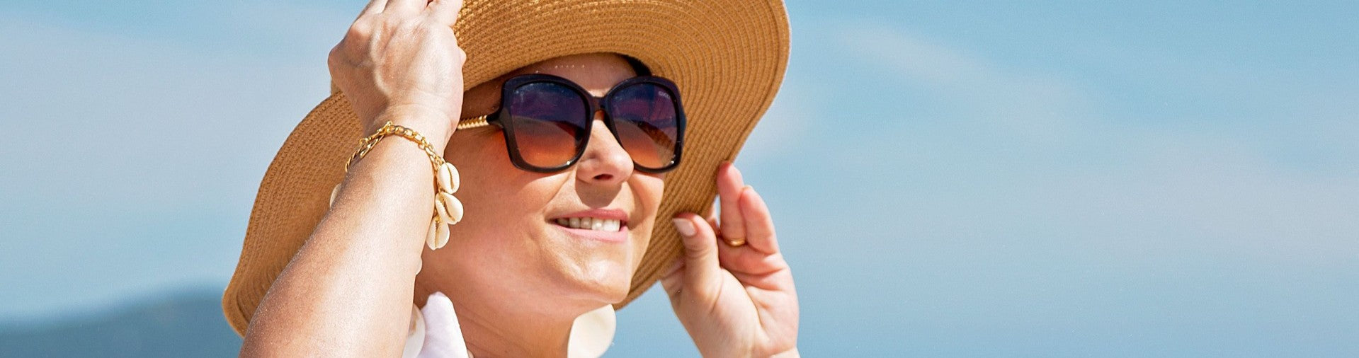 mature woman on a beach in the sun