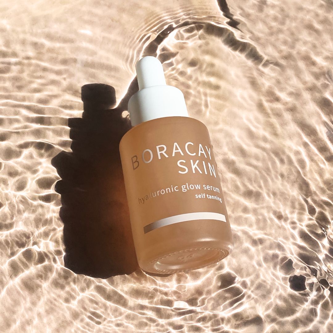 Boracay Skin Hyaluronic Glow Serum bottle sitting in water with natural light