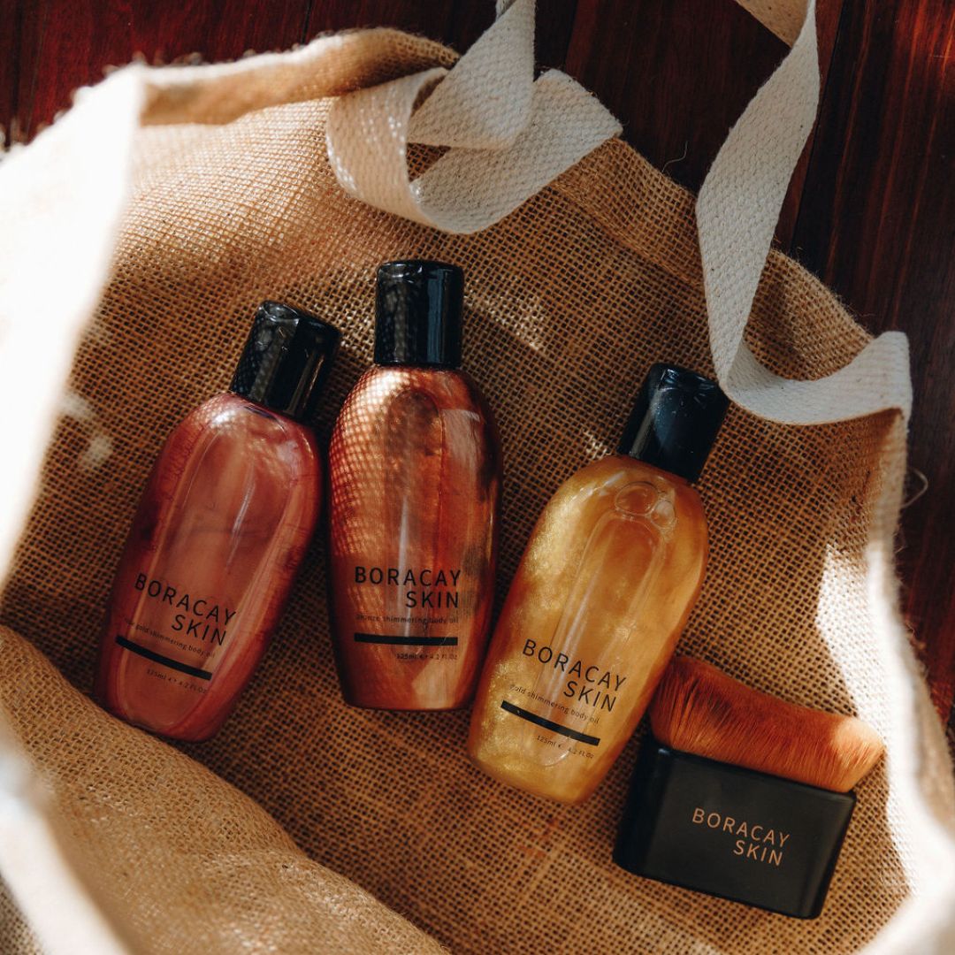 Boracay Skin jute beach tote bag with body oil products and kabuki body brush inside