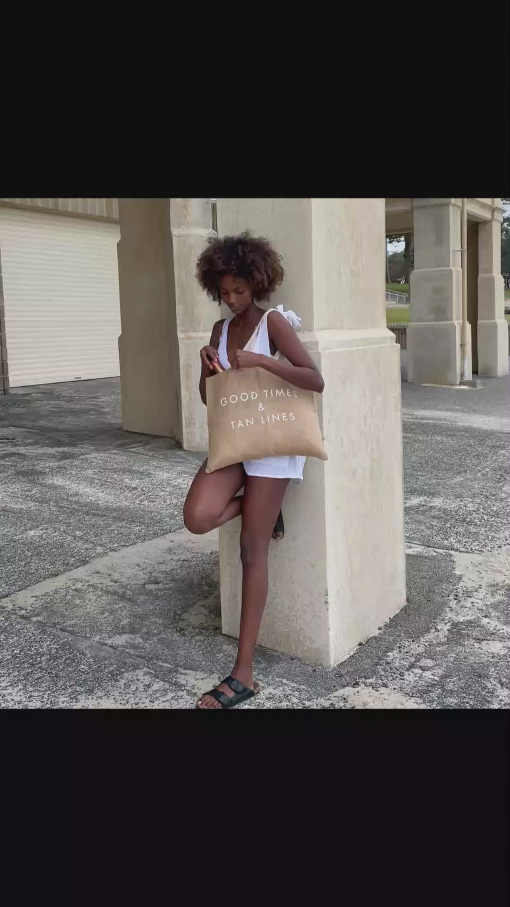 Video showing Boracay Skin jute beach tote bag being carried and used to hold body oils and accessories