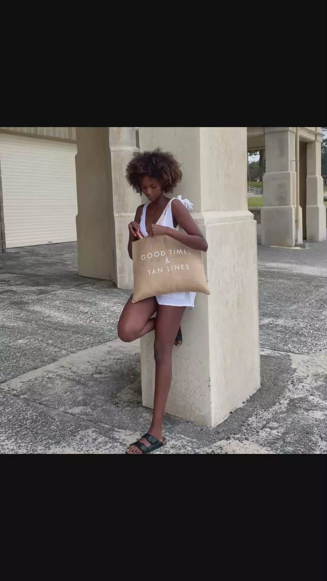 Video showing Boracay Skin jute beach tote bag being carried and used to hold body oils and accessories